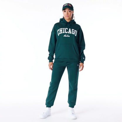 The Female model is wearing New Era Infill Dark Green Oversized Pullover Hoodie 7