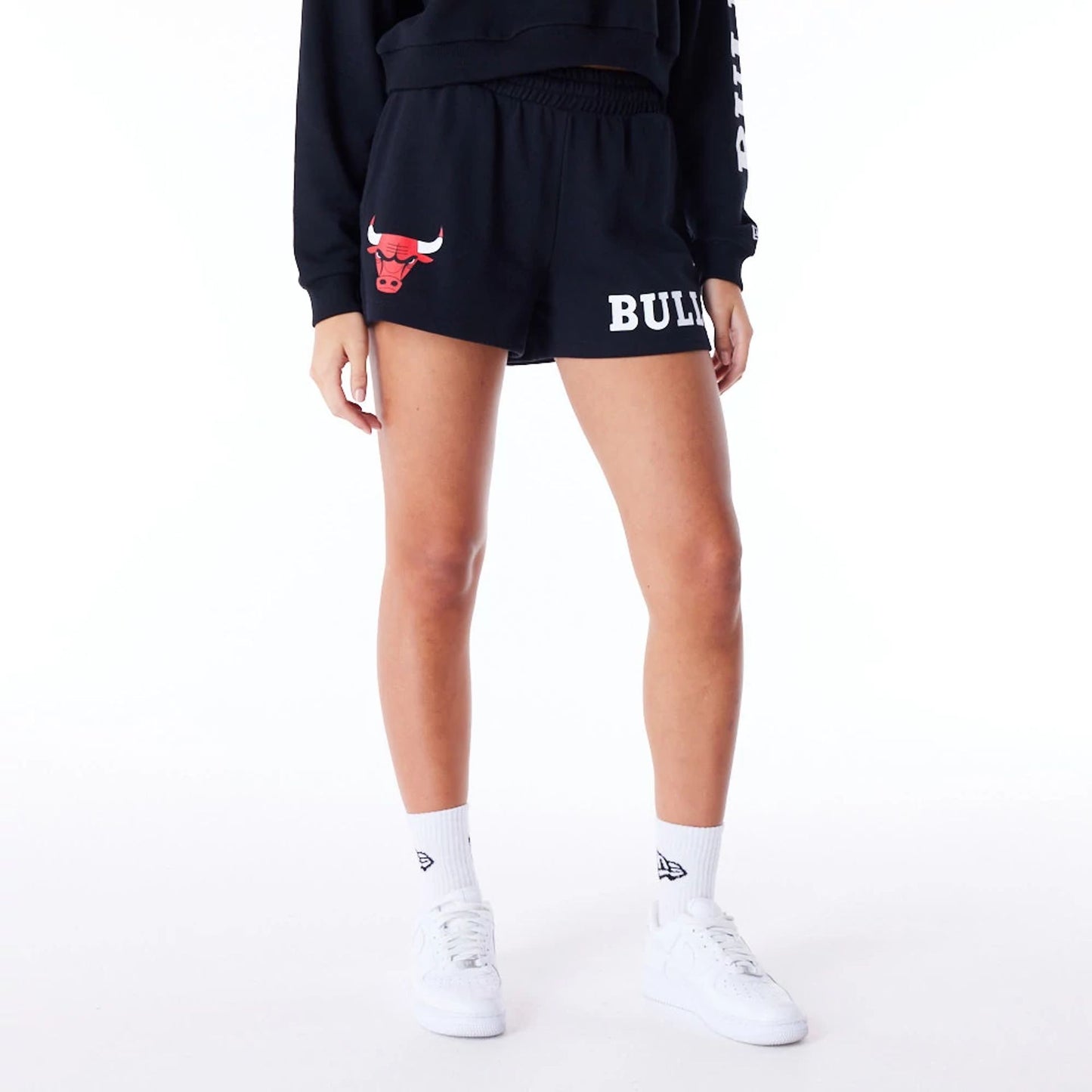 The Female model is wearing Chicago Bulls Womens NBA Wordmark Black Shorts 1