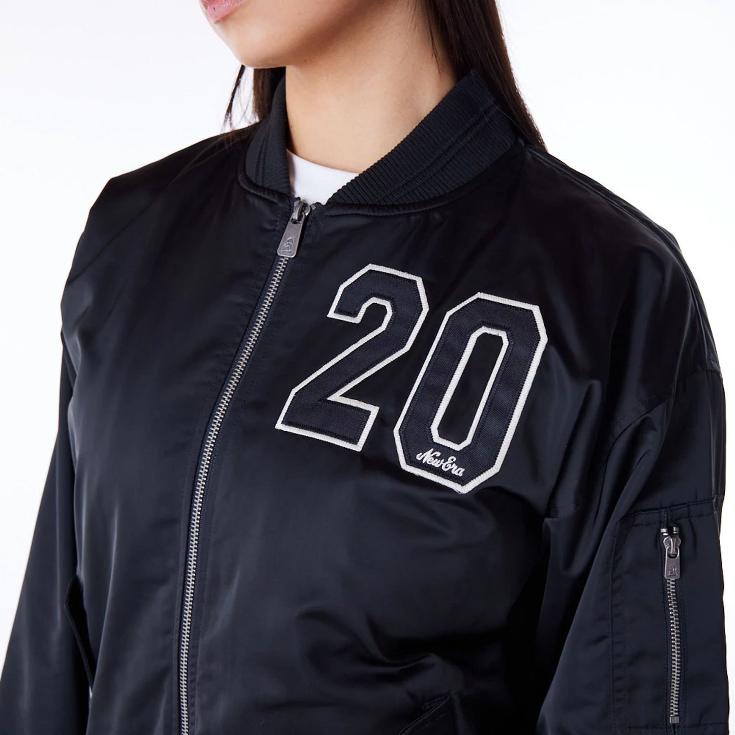 The Female model is wearing New Era Womens Black Bomber Jacket 1