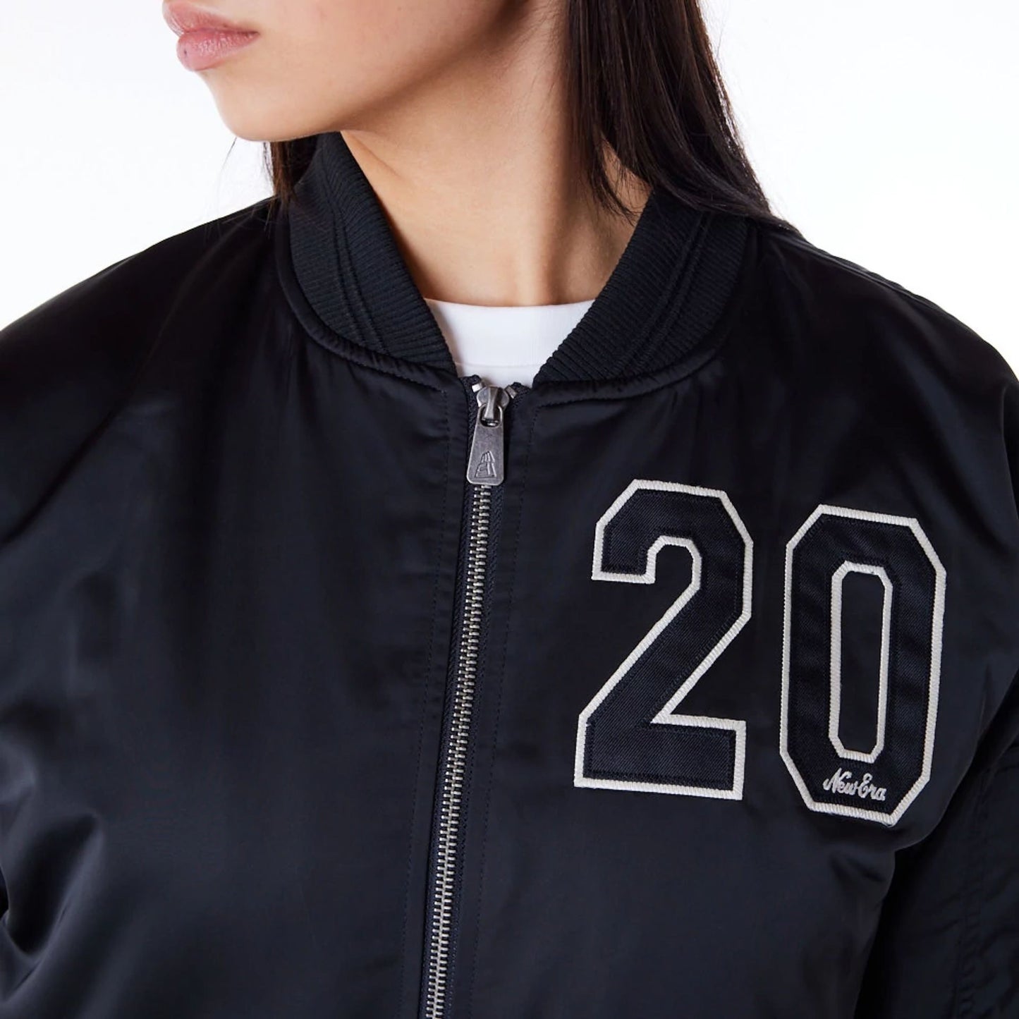 The Female model is wearing New Era Womens Black Bomber Jacket 7