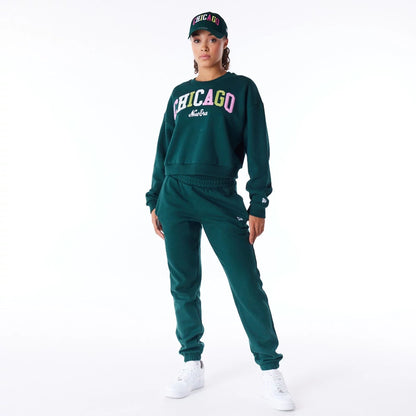 The Female model is wearing New Era Infill Dark Green Crop Crew Neck Sweatshirt 3