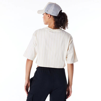 The Female model is wearing New Era Womens Pinstripe Light Beige Crop T-Shirt 6