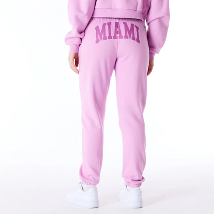 The Female model is wearing New Era Infill Pastel Pink Fleece Joggers 2