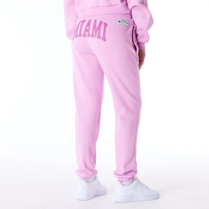 The Female model is wearing New Era Infill Pastel Pink Fleece Joggers 8