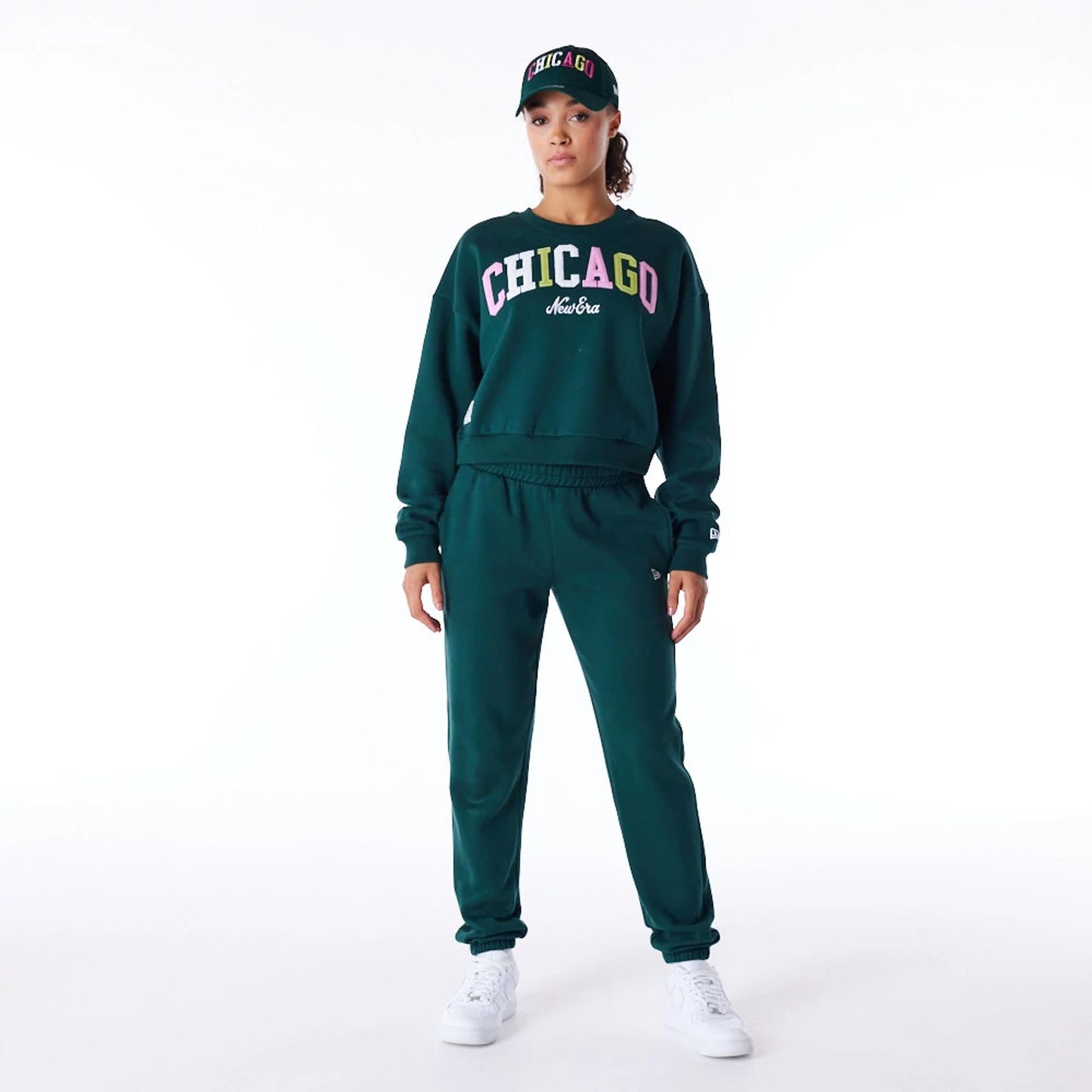 The Female model is wearing New Era Infill Dark Green Fleece Joggers 5