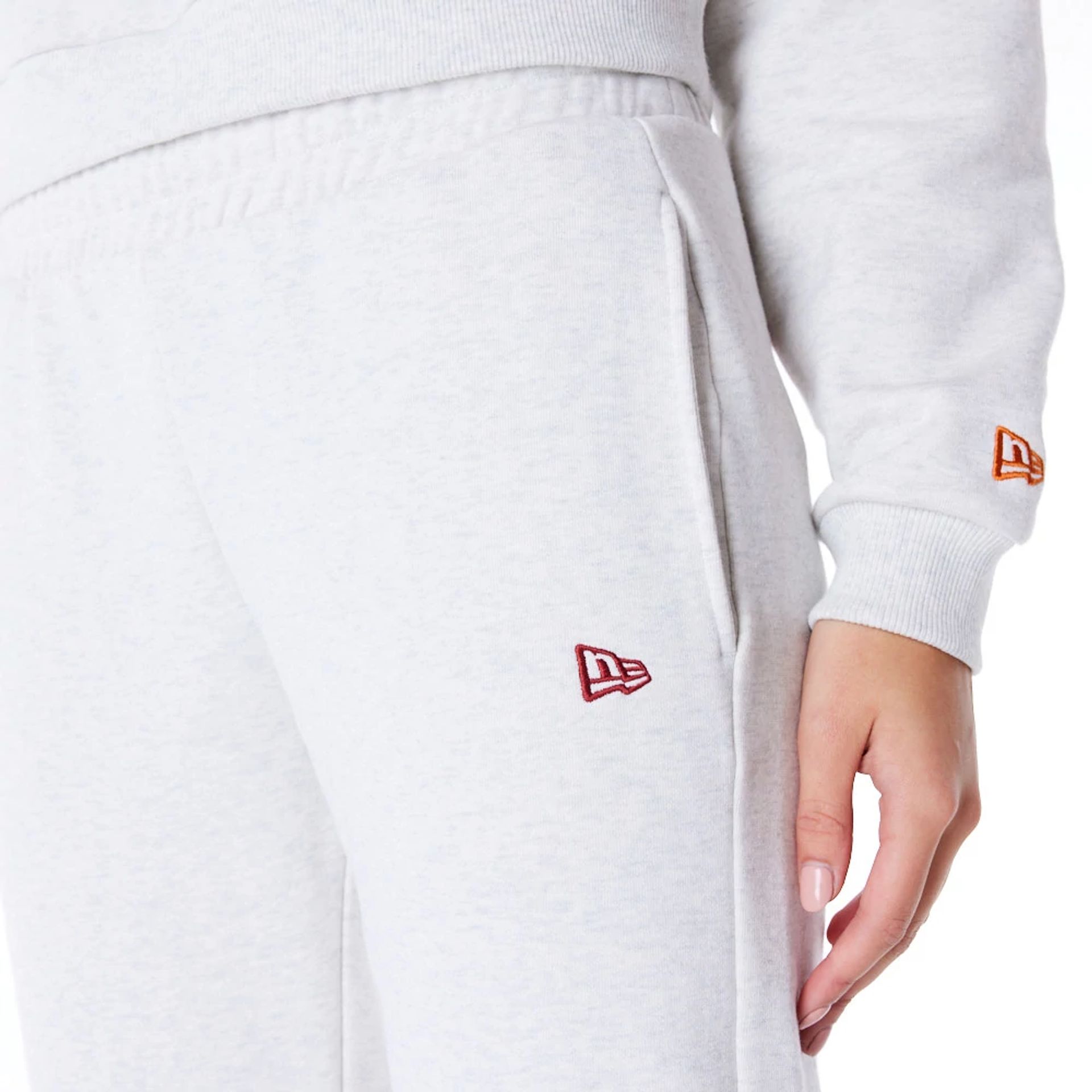 The Female model is wearing New Era Infill Grey Fleece Joggers 10