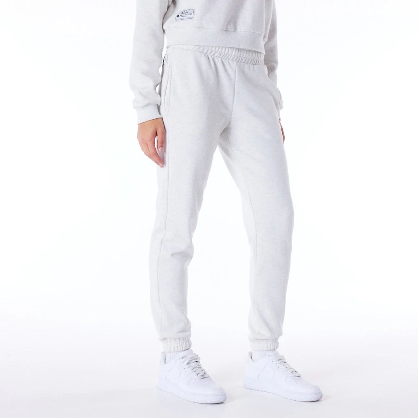 The Female model is wearing New Era Infill Grey Fleece Joggers 5