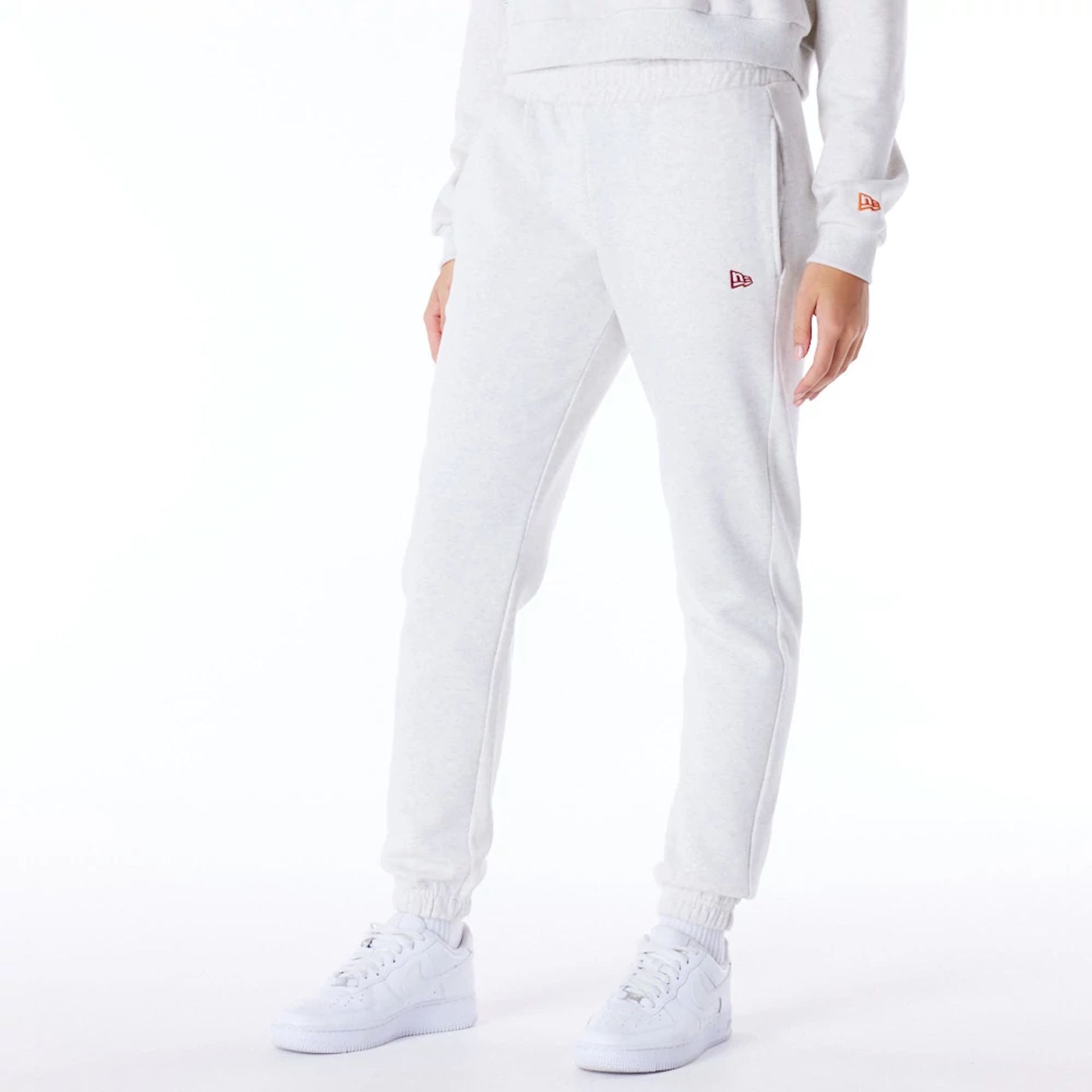 The Female model is wearing New Era Infill Grey Fleece Joggers 1