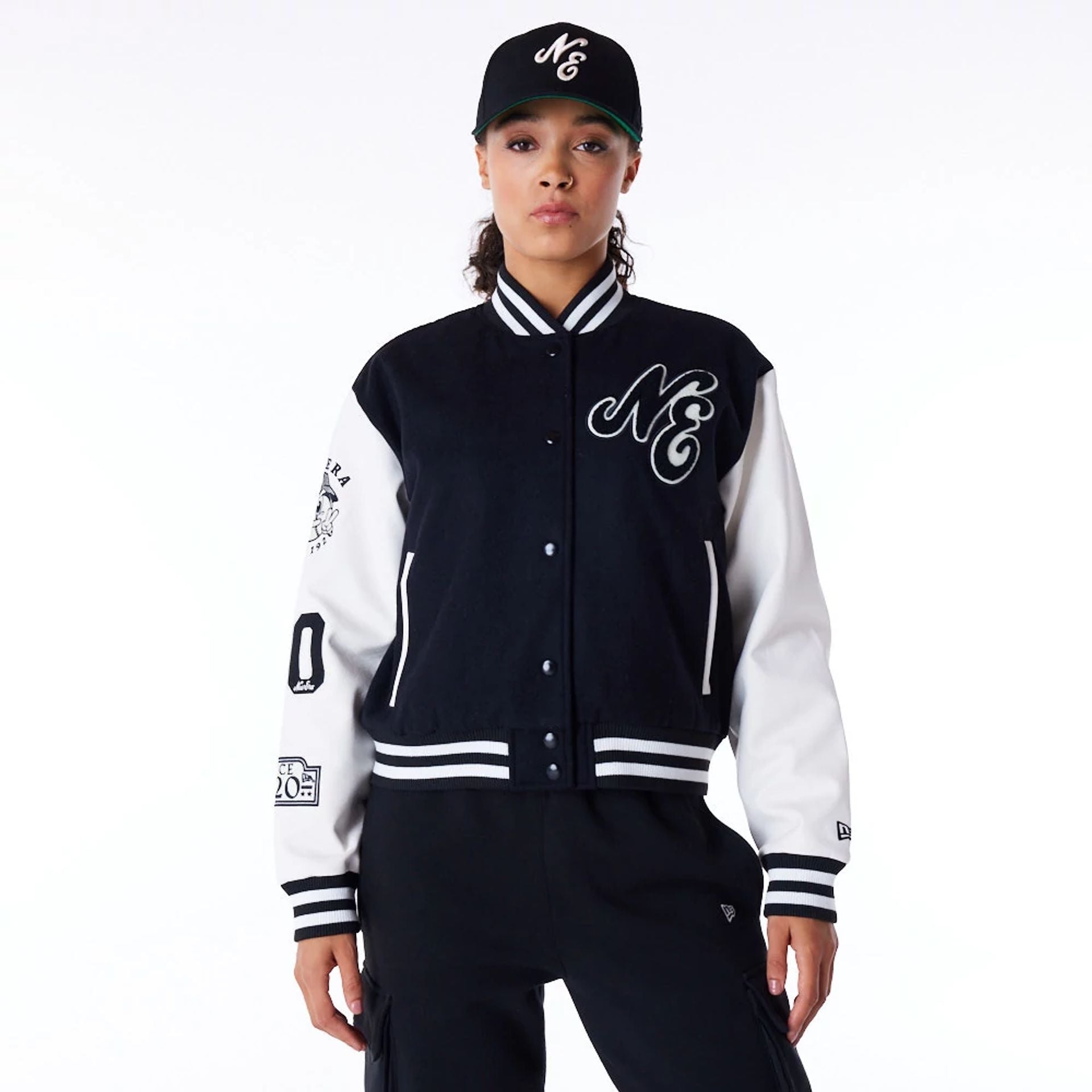 The Female model is wearing New Era Womens Black Varsity Jacket 1