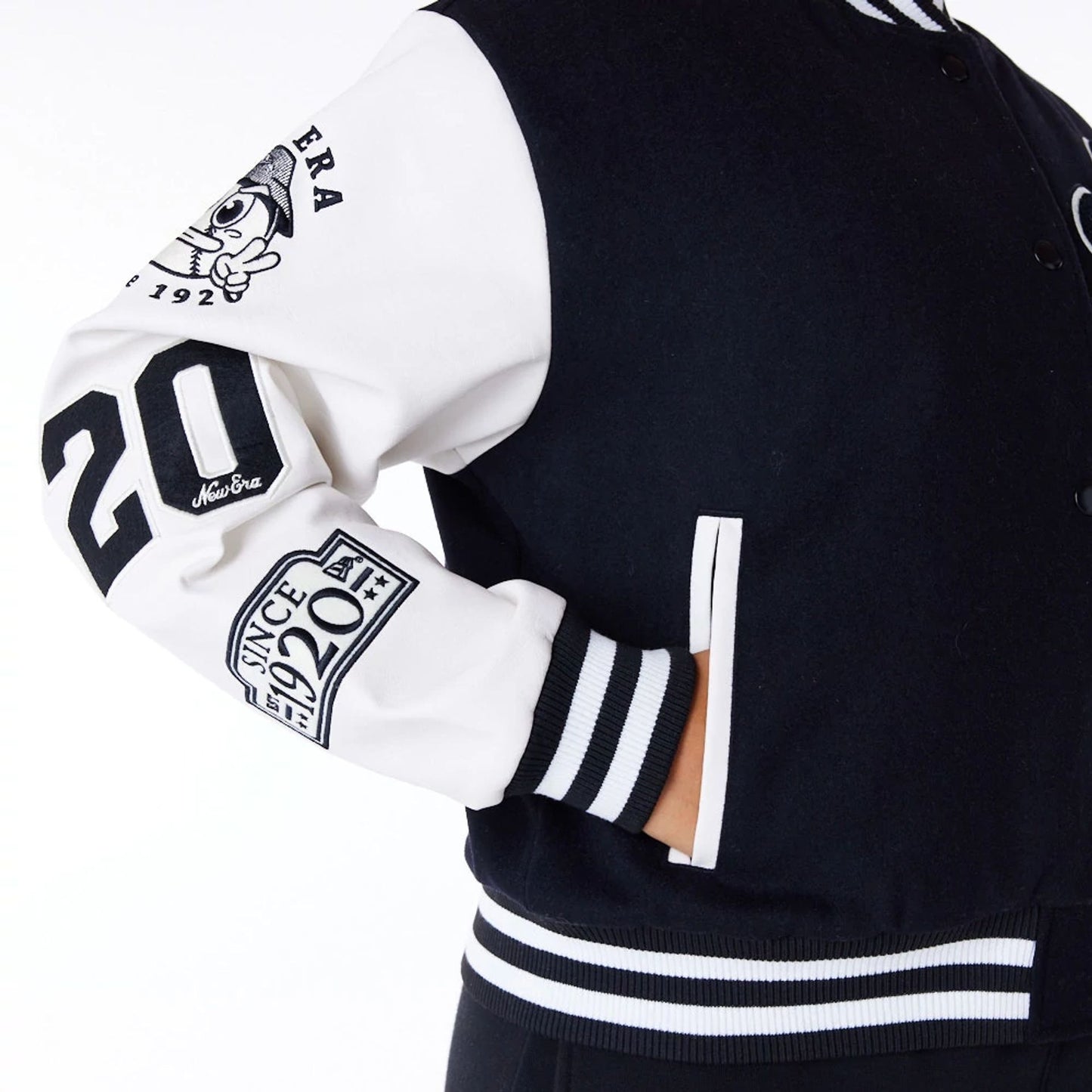 The Female model is wearing New Era Womens Black Varsity Jacket 5