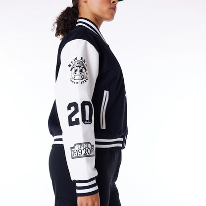 The Female model is wearing New Era Womens Black Varsity Jacket 6