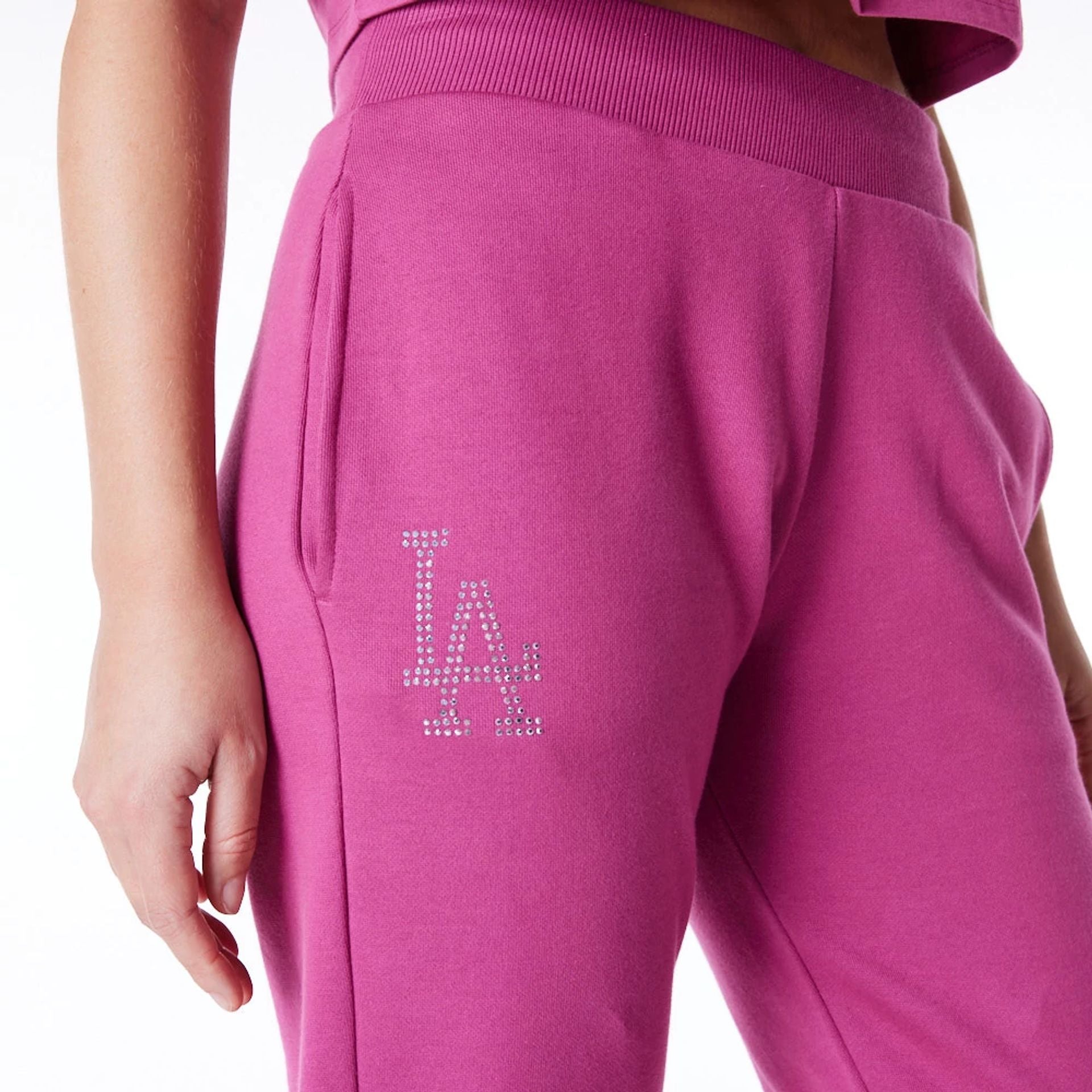 The Female model is wearing LA Dodgers Womens MLB Diamante Purple Fleece Joggers 1