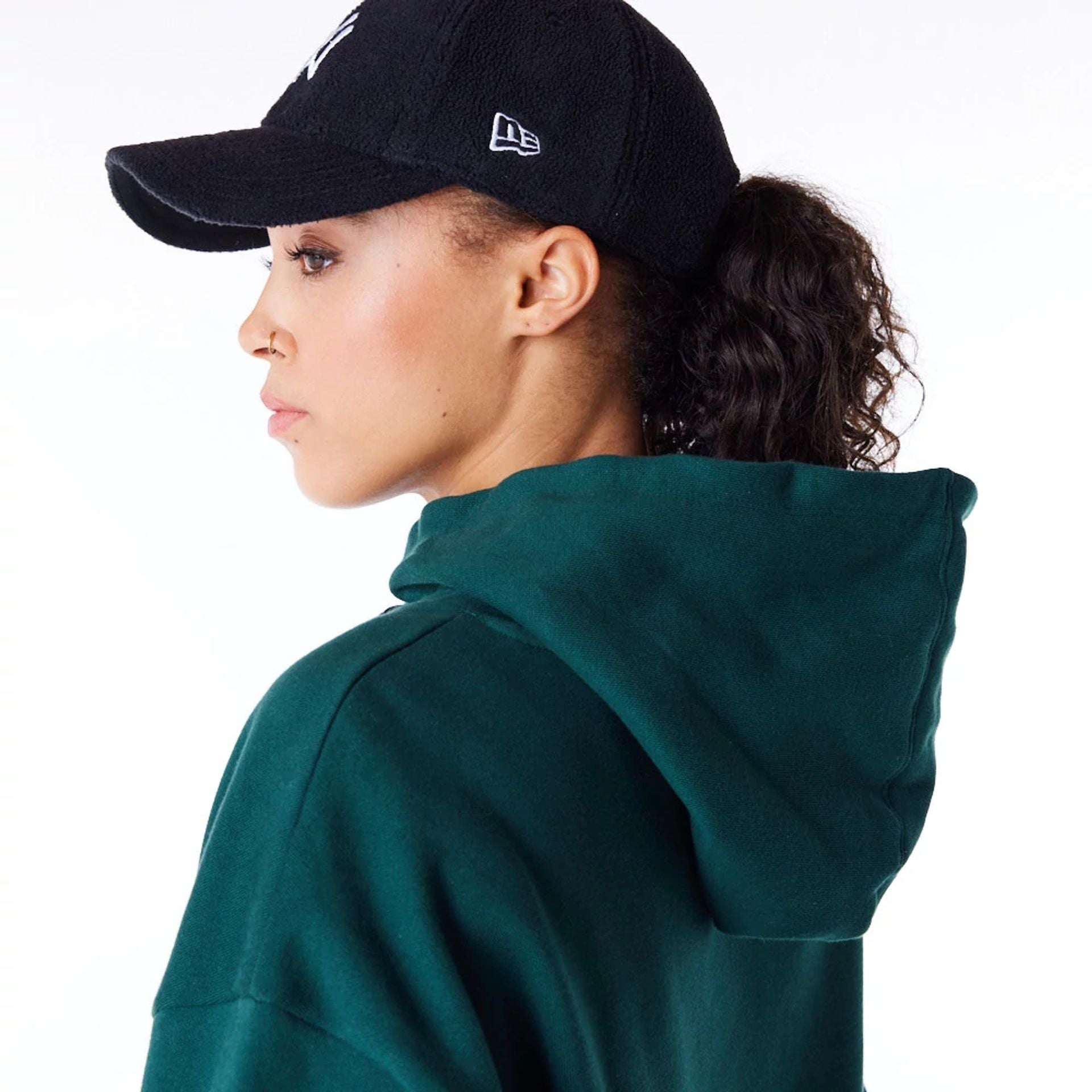 The Female model is wearing New York Yankees Womens MLB Diamante Dark Green Pullover Hoodie 6