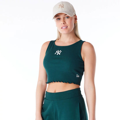 The Female model is wearing New York Yankees Womens MLB Rib Dark Green Crop Tank Top 6