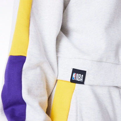 The Female model is wearing LA Lakers Womens NBA Colour Block Grey Pullover Hoodie 7