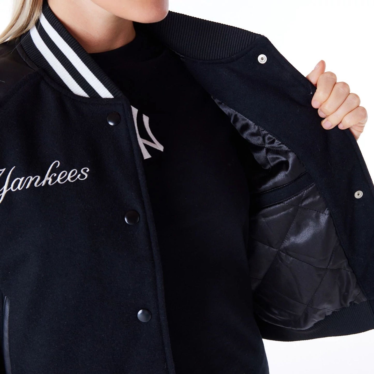 The Female model is wearing New York Yankees Womens MLB Black Varsity Jacket 3