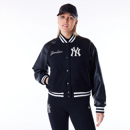 The Female model is wearing New York Yankees Womens MLB Black Varsity Jacket 1