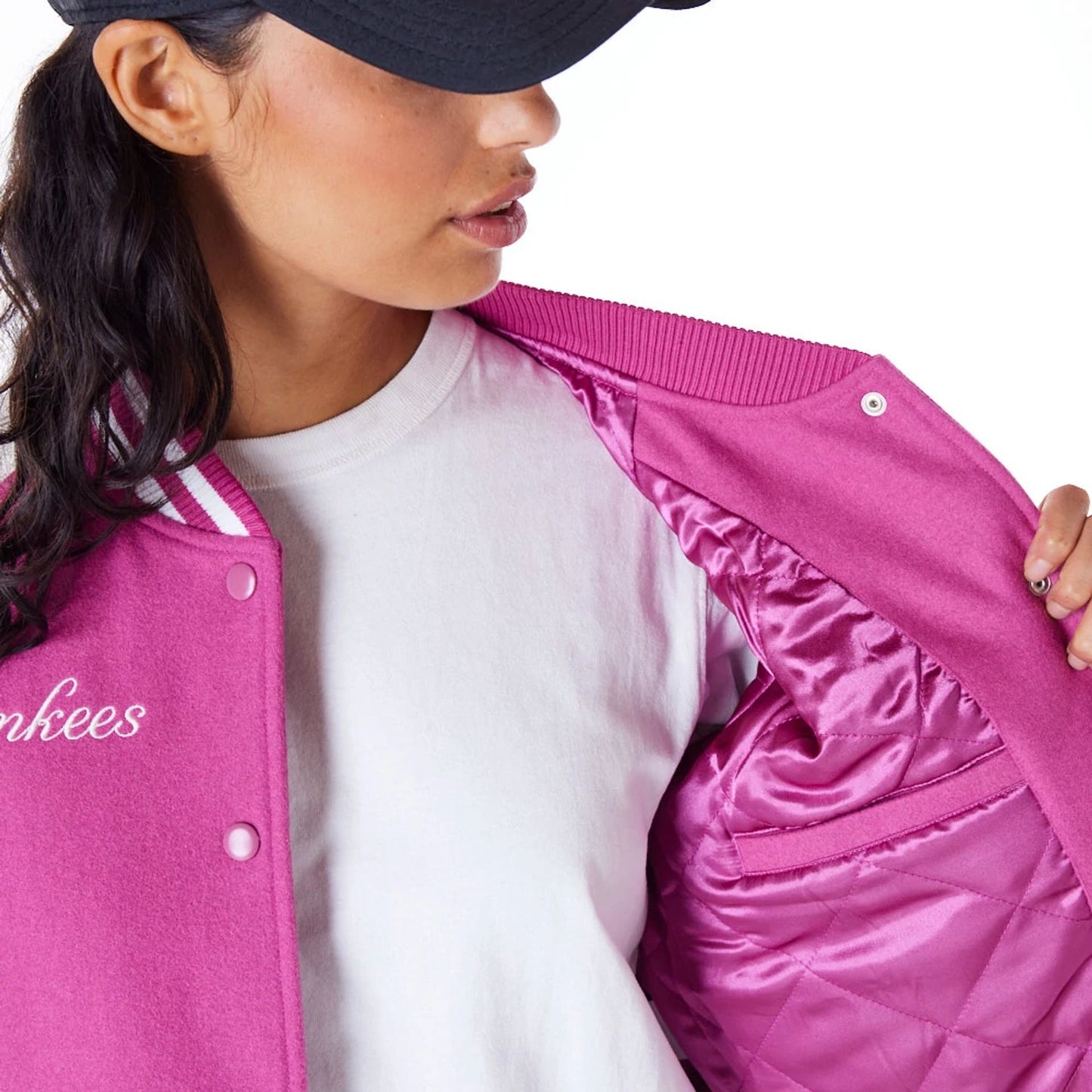 The Female model is wearing New York Yankees Womens MLB Purple Varsity Jacket 3