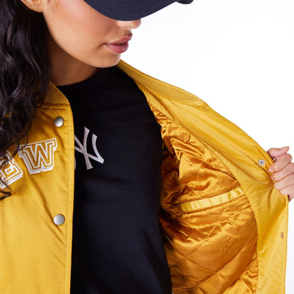 The Female model is wearing New York Yankees Womens MLB Dark Yellow Bomber Jacket 6