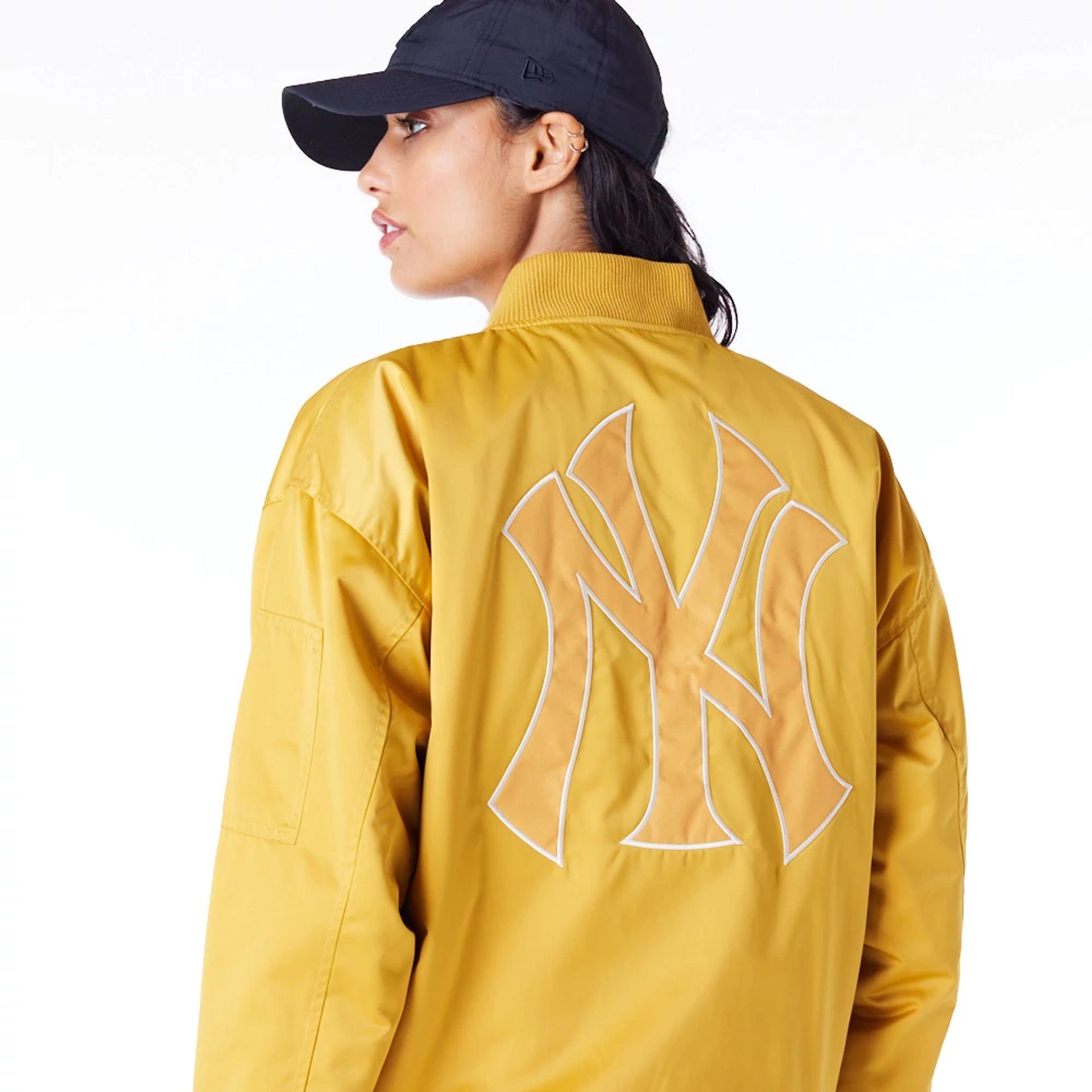 The Female model is wearing New York Yankees Womens MLB Dark Yellow Bomber Jacket 3