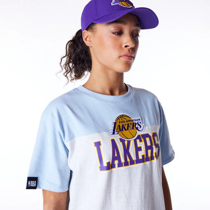 The Female model is wearing LA Lakers Womens NBA Pastel Blue Oversized T-Shirt 5