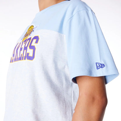 The Female model is wearing LA Lakers Womens NBA Pastel Blue Oversized T-Shirt 6