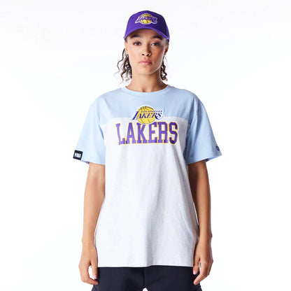 The Female model is wearing LA Lakers Womens NBA Pastel Blue Oversized T-Shirt 1