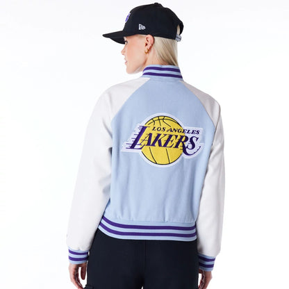 The Female model is wearing LA Lakers Womens NBA Pastel Blue Varsity Jacket 9