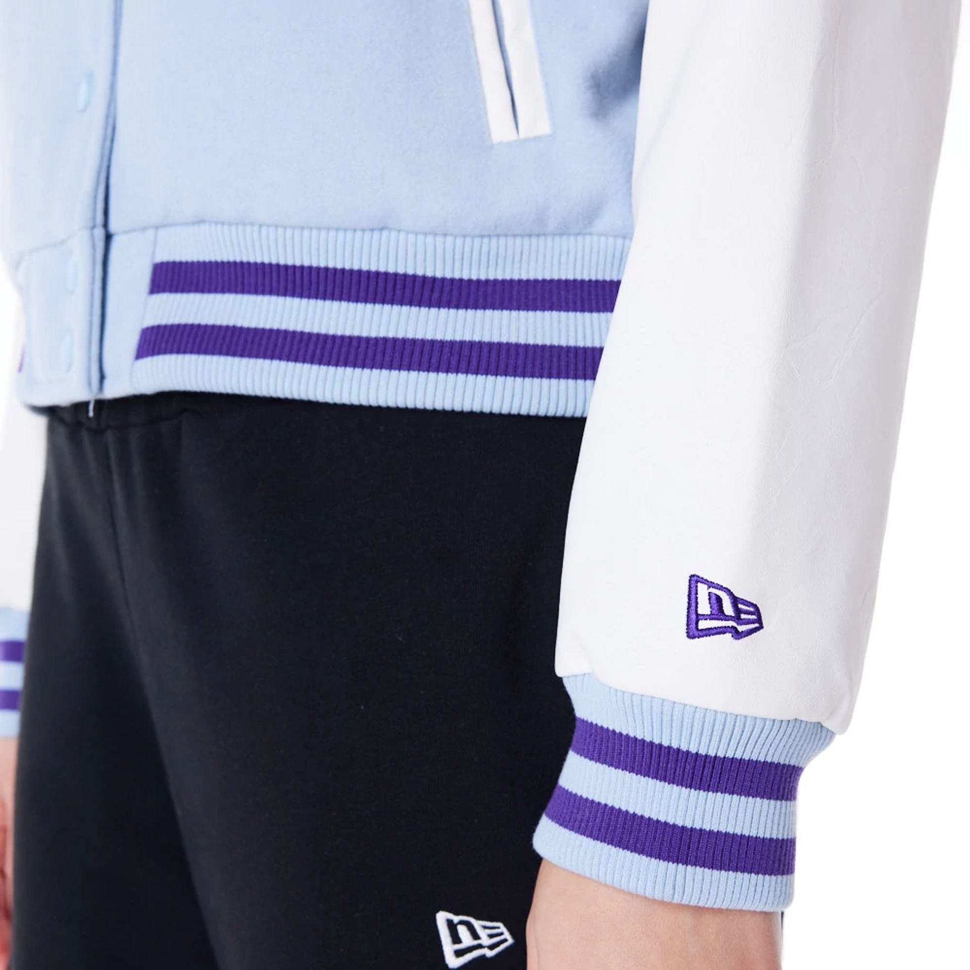 The Female model is wearing LA Lakers Womens NBA Pastel Blue Varsity Jacket 6