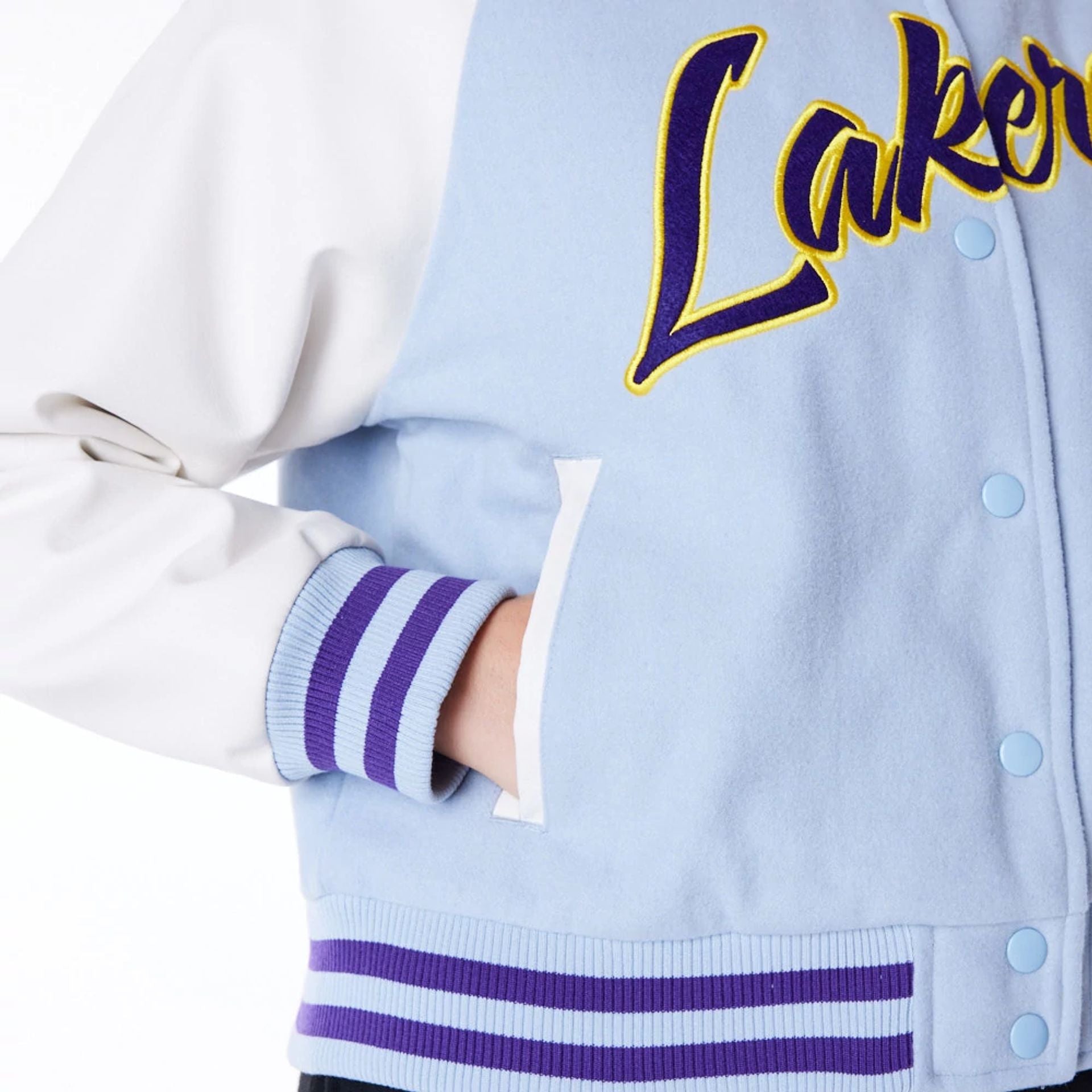 The Female model is wearing LA Lakers Womens NBA Pastel Blue Varsity Jacket 4