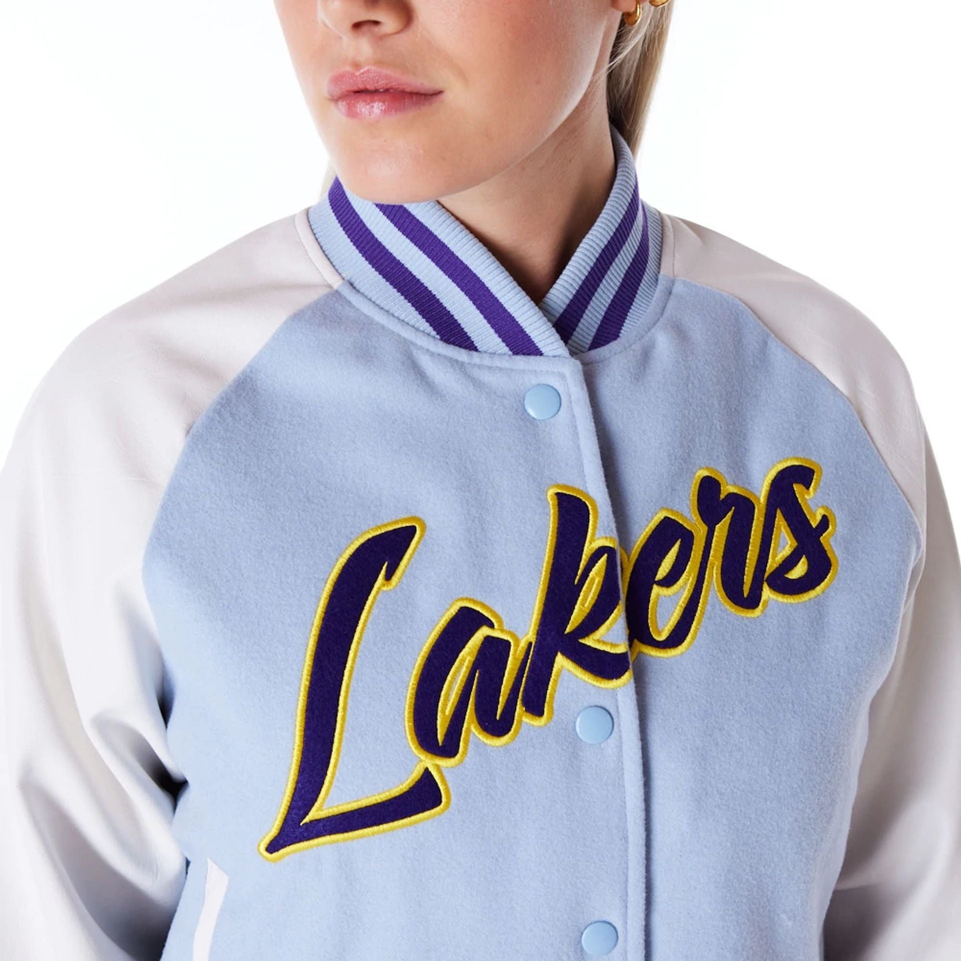 The Female model is wearing LA Lakers Womens NBA Pastel Blue Varsity Jacket 5