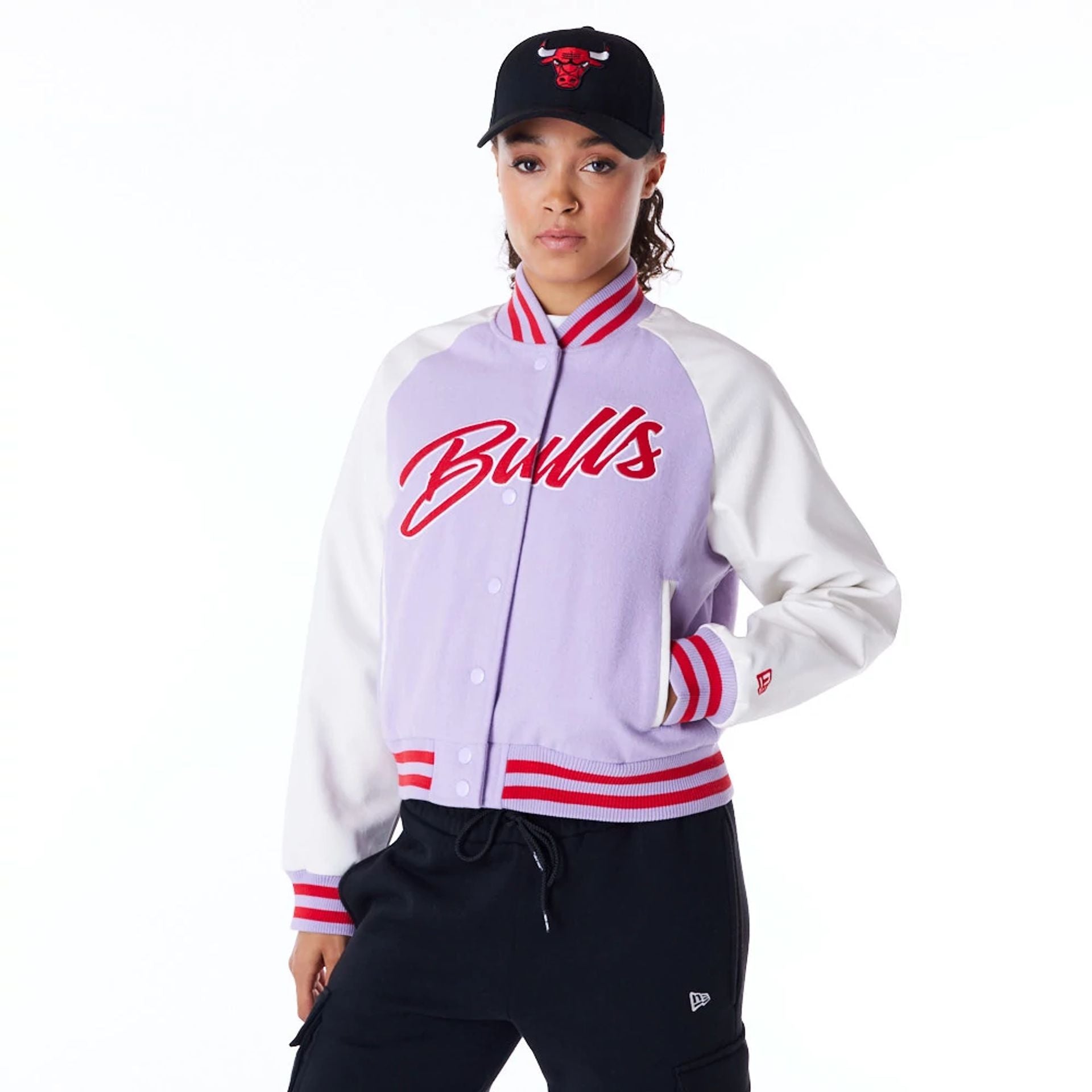 The Female model is wearing Chicago Bulls Womens NBA Pastel Purple Varsity Jacket 1