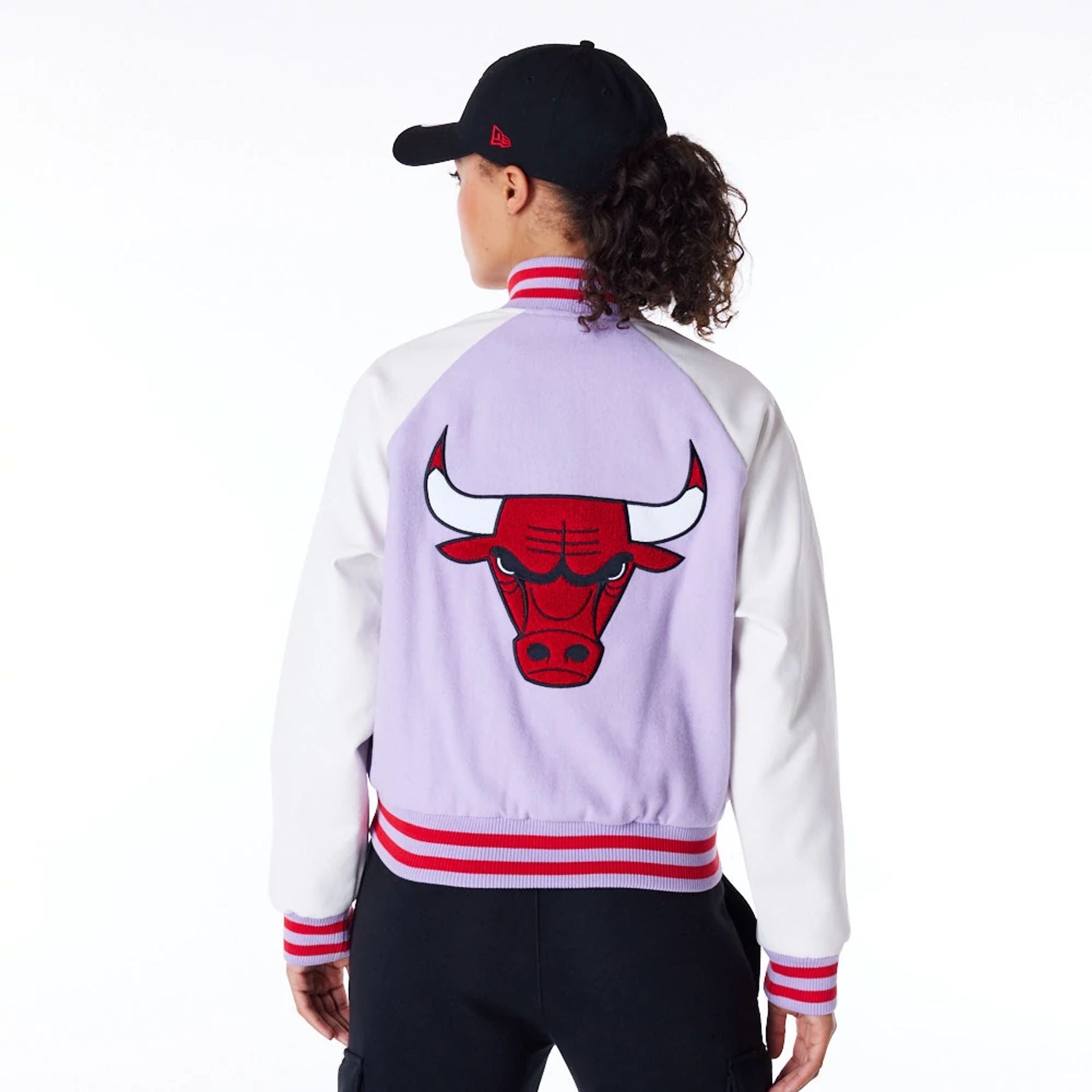 The Female model is wearing Chicago Bulls Womens NBA Pastel Purple Varsity Jacket 6