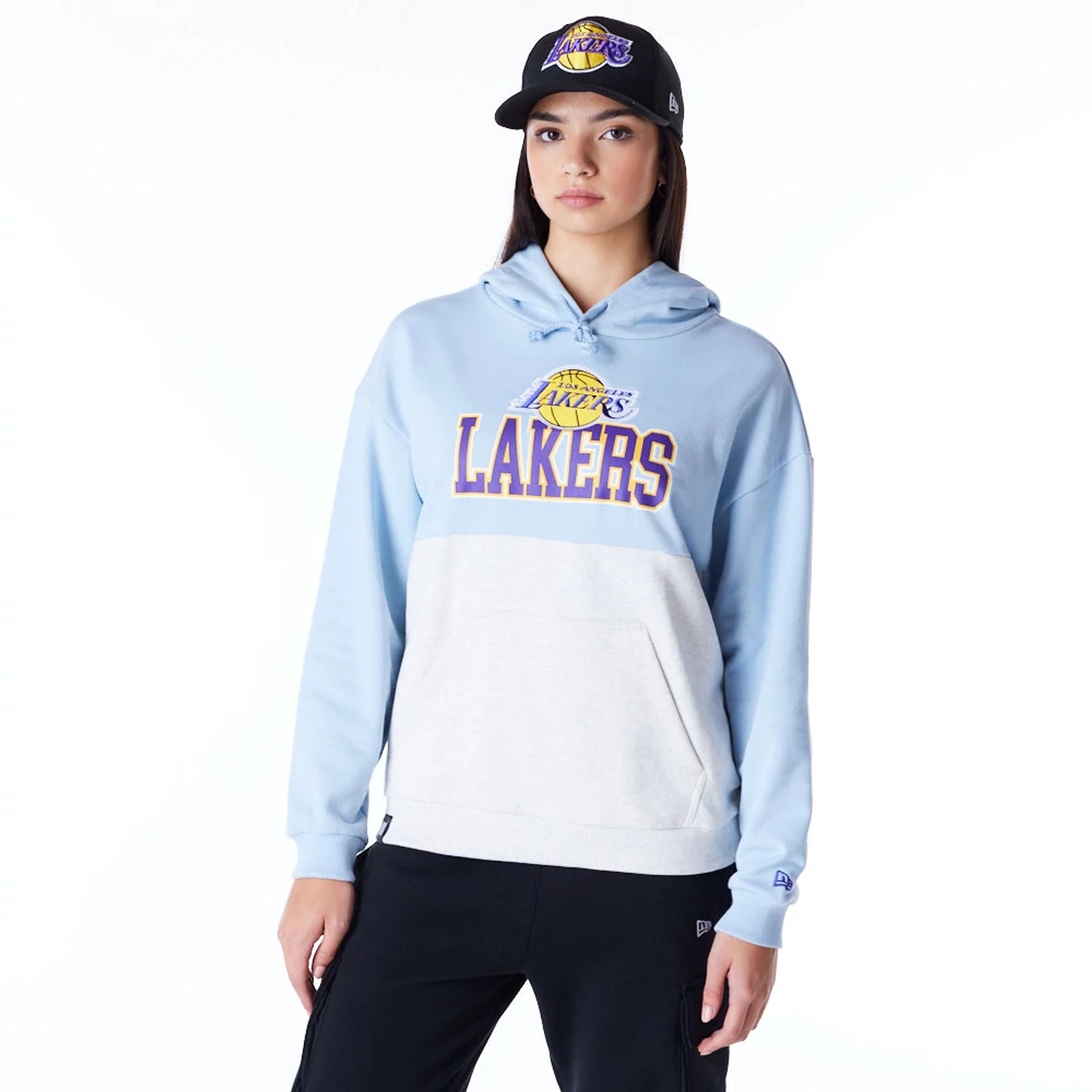 The Female model is wearing LA Lakers Womens NBA Pastel Blue Oversized Pullover Hoodie 1