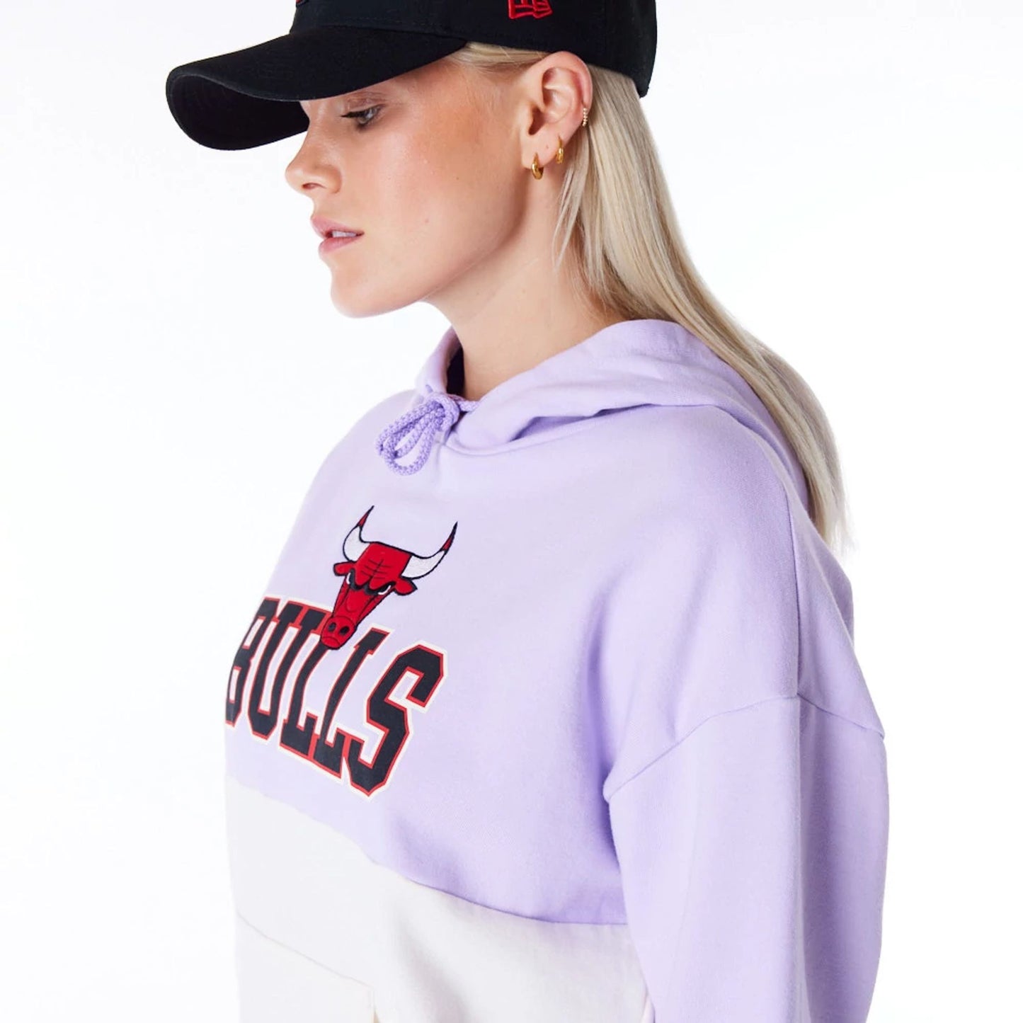 The Female model is wearing Chicago Bulls Womens NBA Pastel Purple Oversized Pullover Hoodie 5