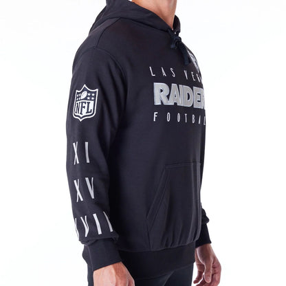 The Male model is wearing Las Vegas Raiders NFL Patch Black Oversized Pullover Hoodie 6