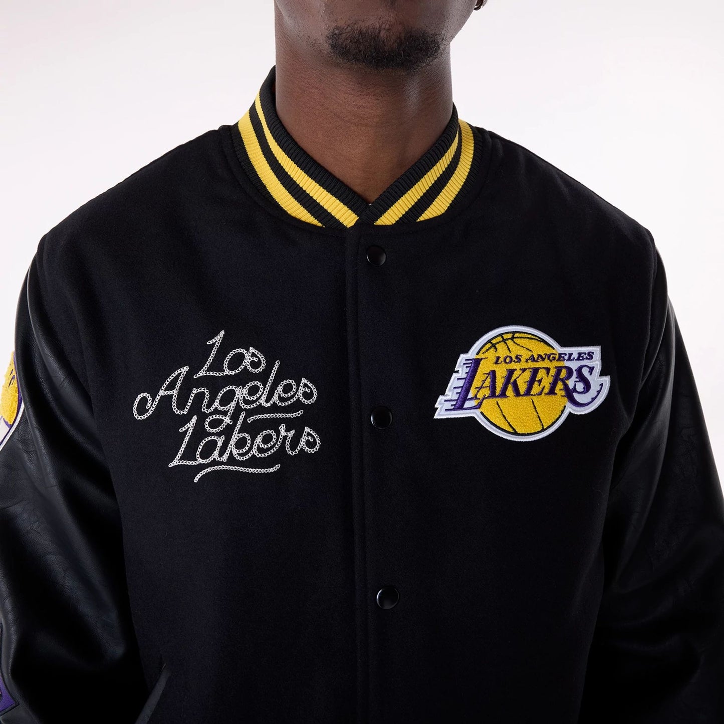 The Male model is wearing LA Lakers NBA Patch Black Varsity Jacket 2