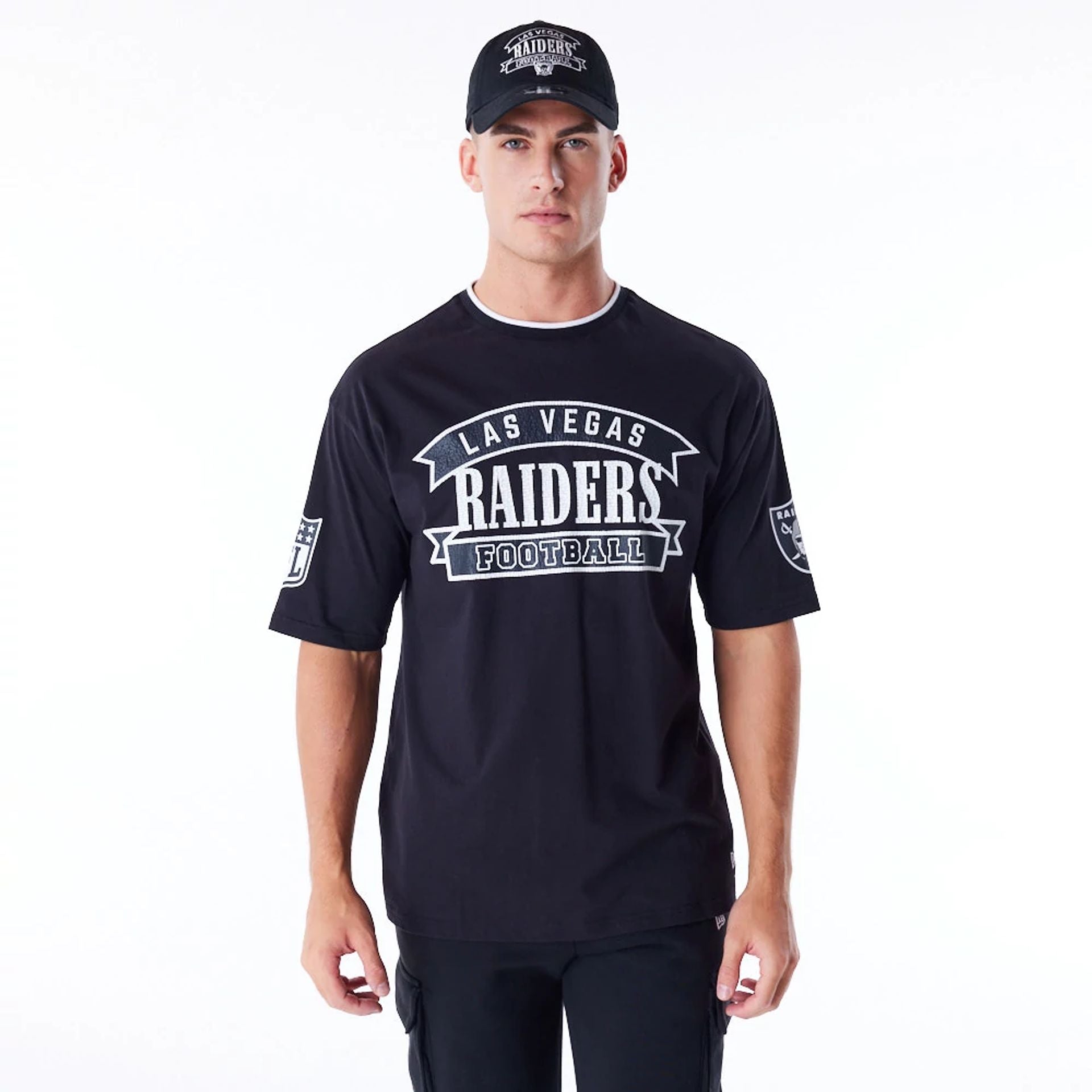 The Male model is wearing Las Vegas Raiders NFL Graphic Black Oversized T-Shirt 1