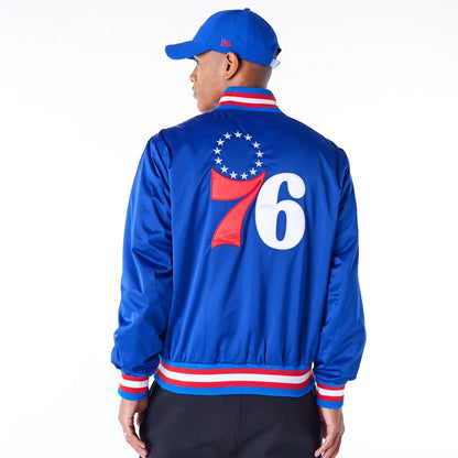 The Male model is wearing Philadelphia 76ers NBA Satin Blue Bomber Jacket 7