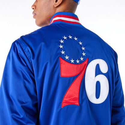 The Male model is wearing Philadelphia 76ers NBA Satin Blue Bomber Jacket 4