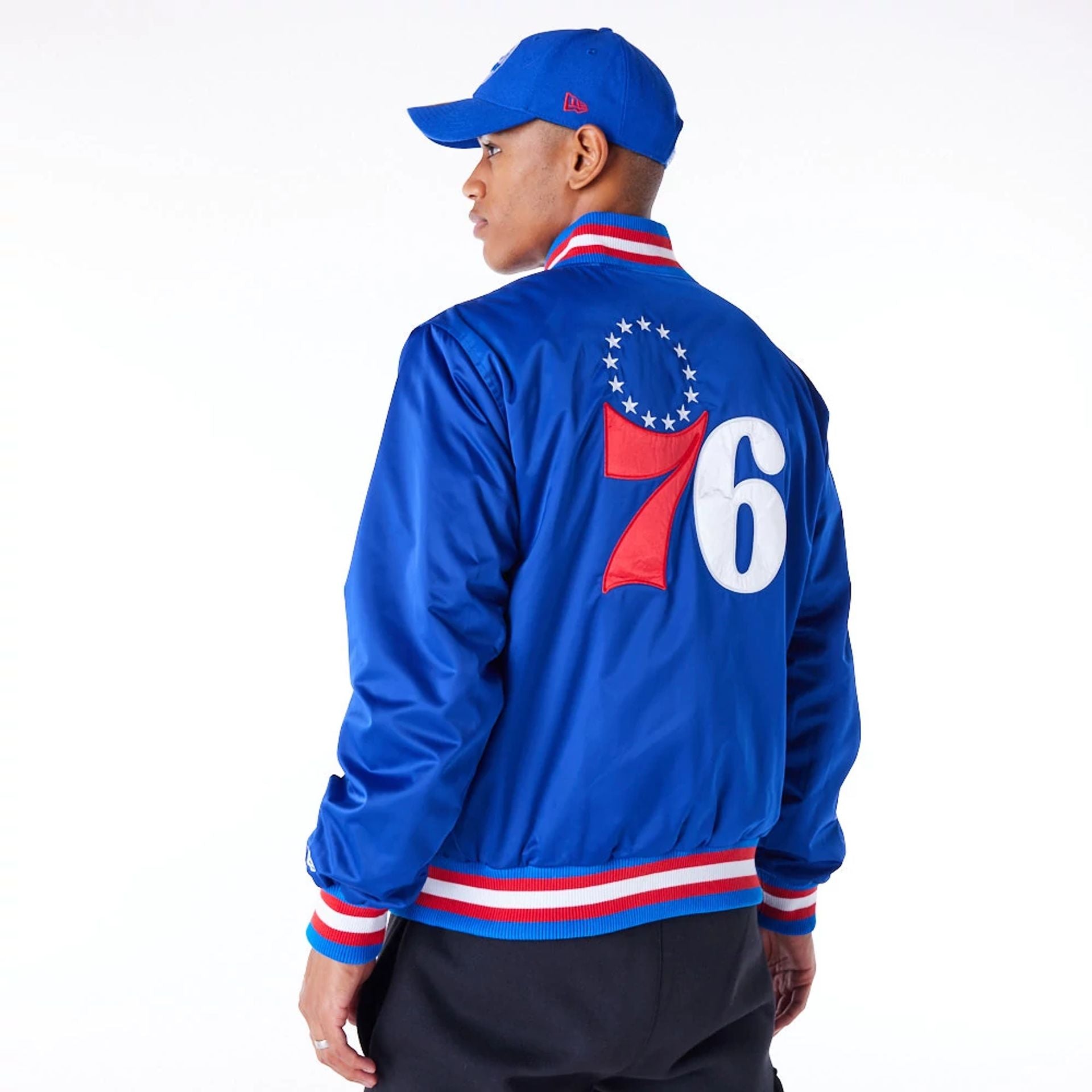 The Male model is wearing Philadelphia 76ers NBA Satin Blue Bomber Jacket 2