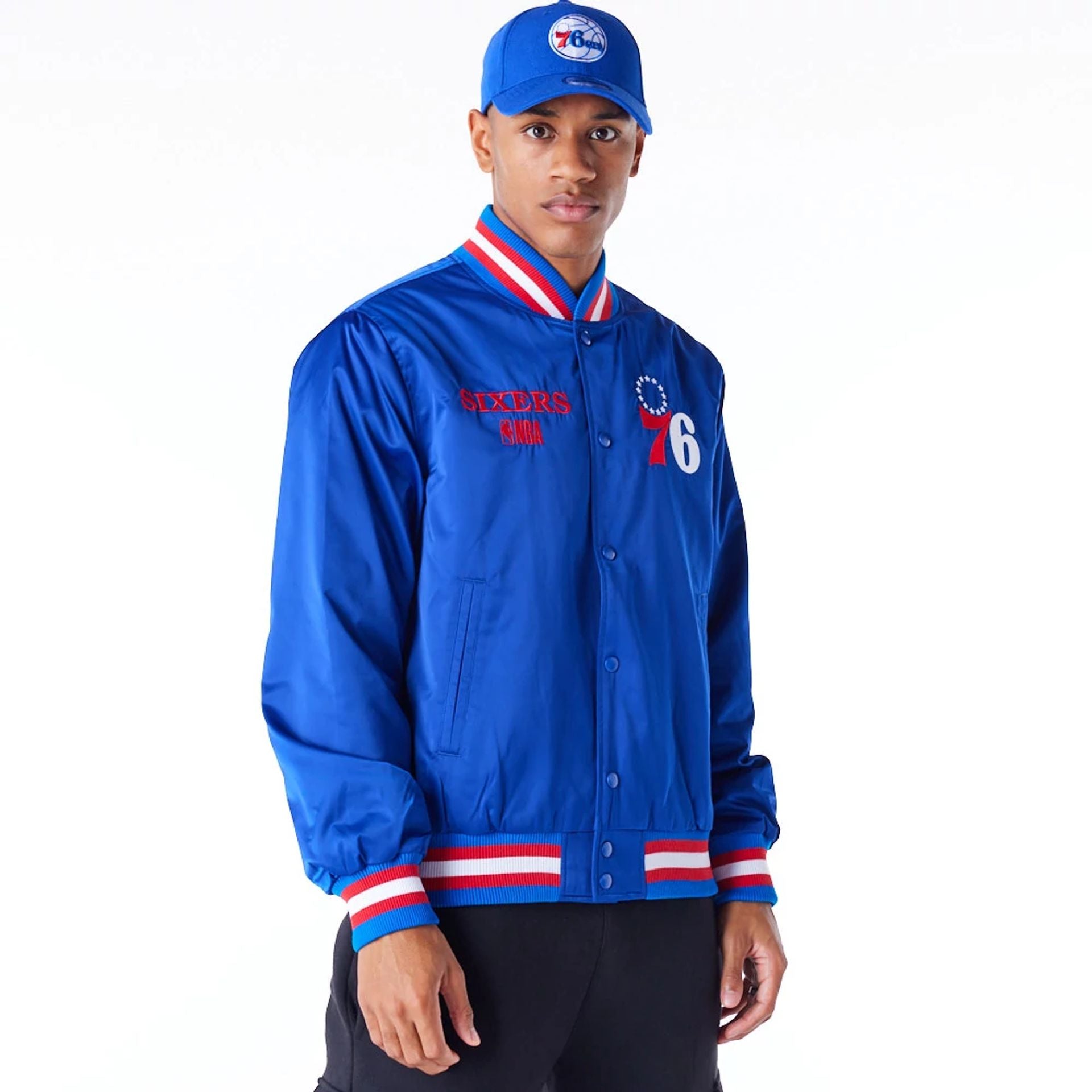 The Male model is wearing Philadelphia 76ers NBA Satin Blue Bomber Jacket 1