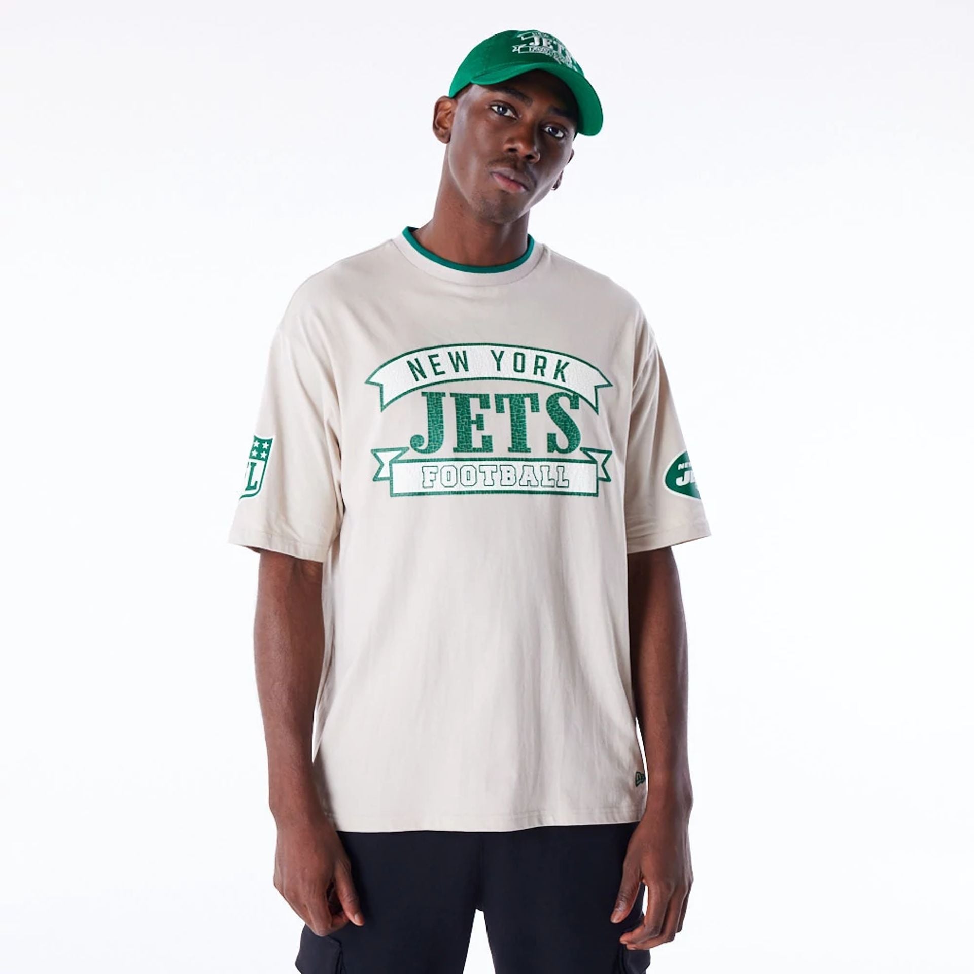 The Male model is wearing New York Jets NFL Graphic Open White Oversized T-Shirt 1