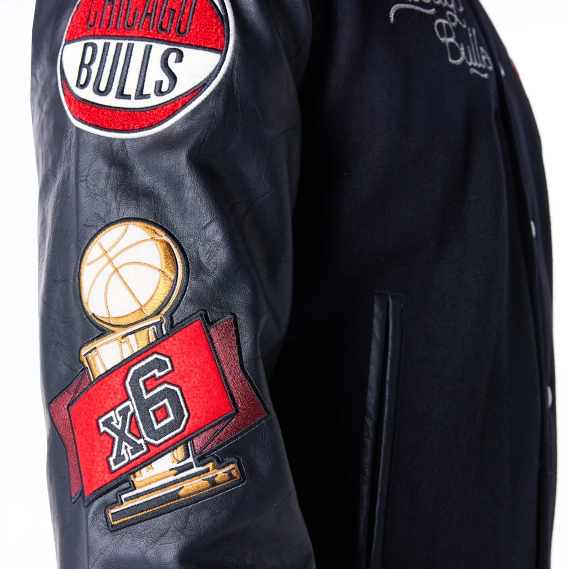 The Male model is wearing Chicago Bulls NBA Patch Black and Red Varsity Jacket 9