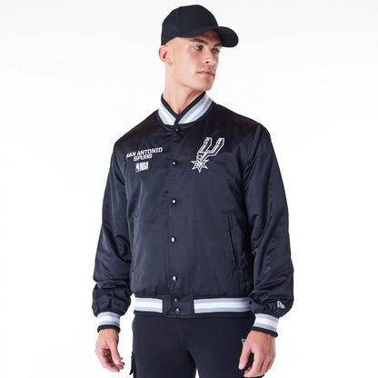 The Male model is wearing San Antonio Spurs NBA Satin Black Bomber Jacket 1