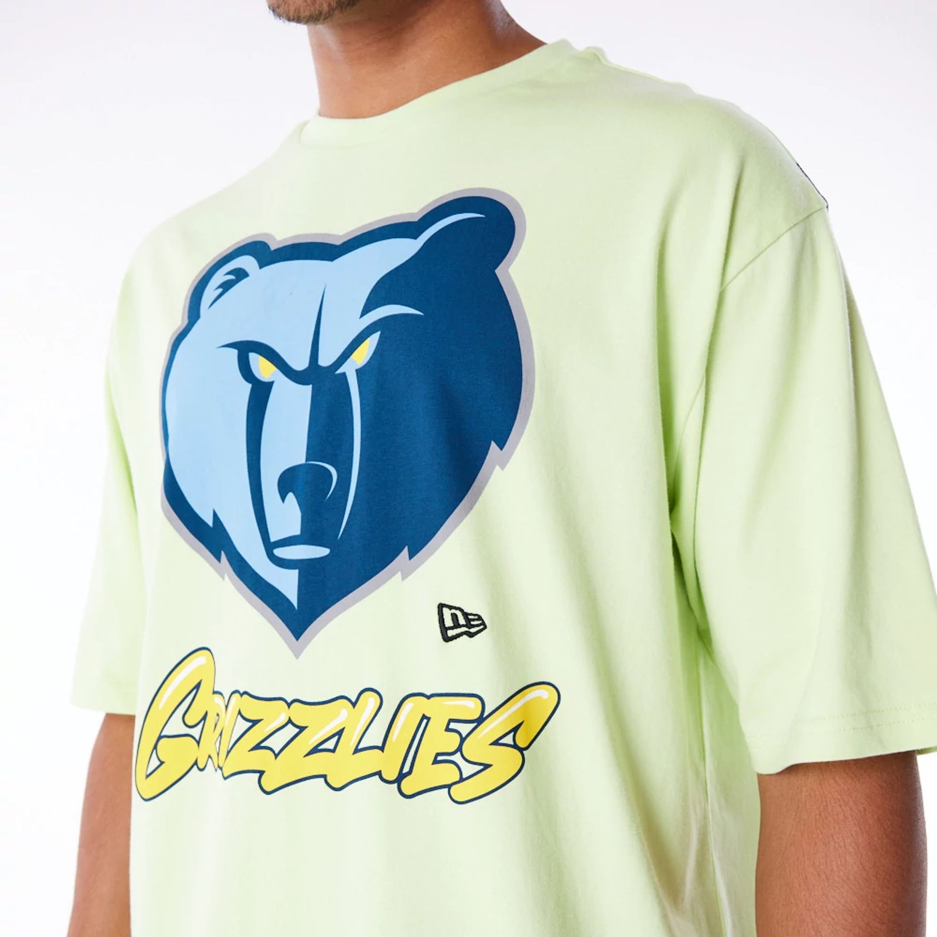 The Male model is wearing Memphis Grizzlies NBA Wordmark Pastel Green Oversized T-Shirt 7