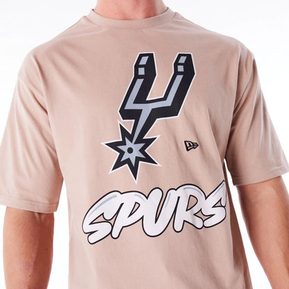 The Male model is wearing San Antonio Spurs NBA Wordmark Beige Oversized T-Shirt 4