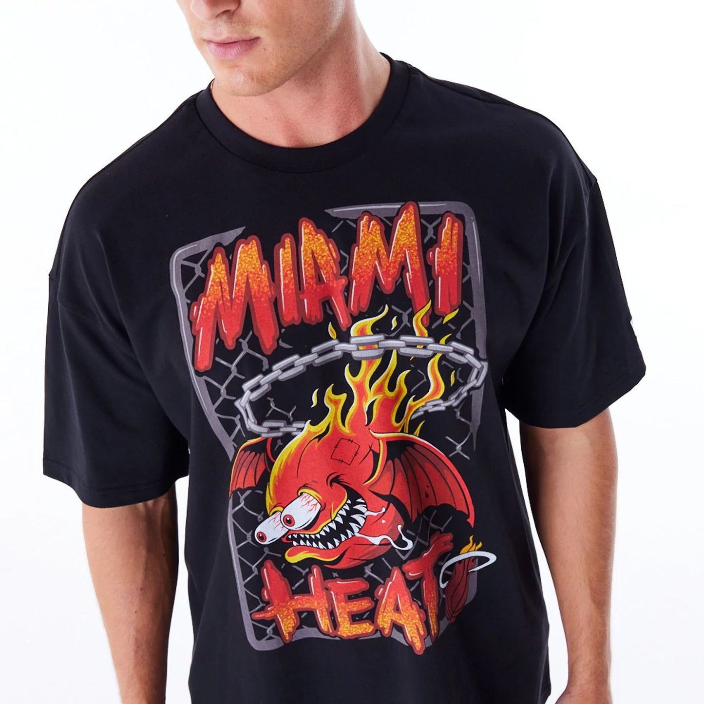 The Male model is wearing Miami Heat Graphic Black Drop Shoulder T-Shirt 1