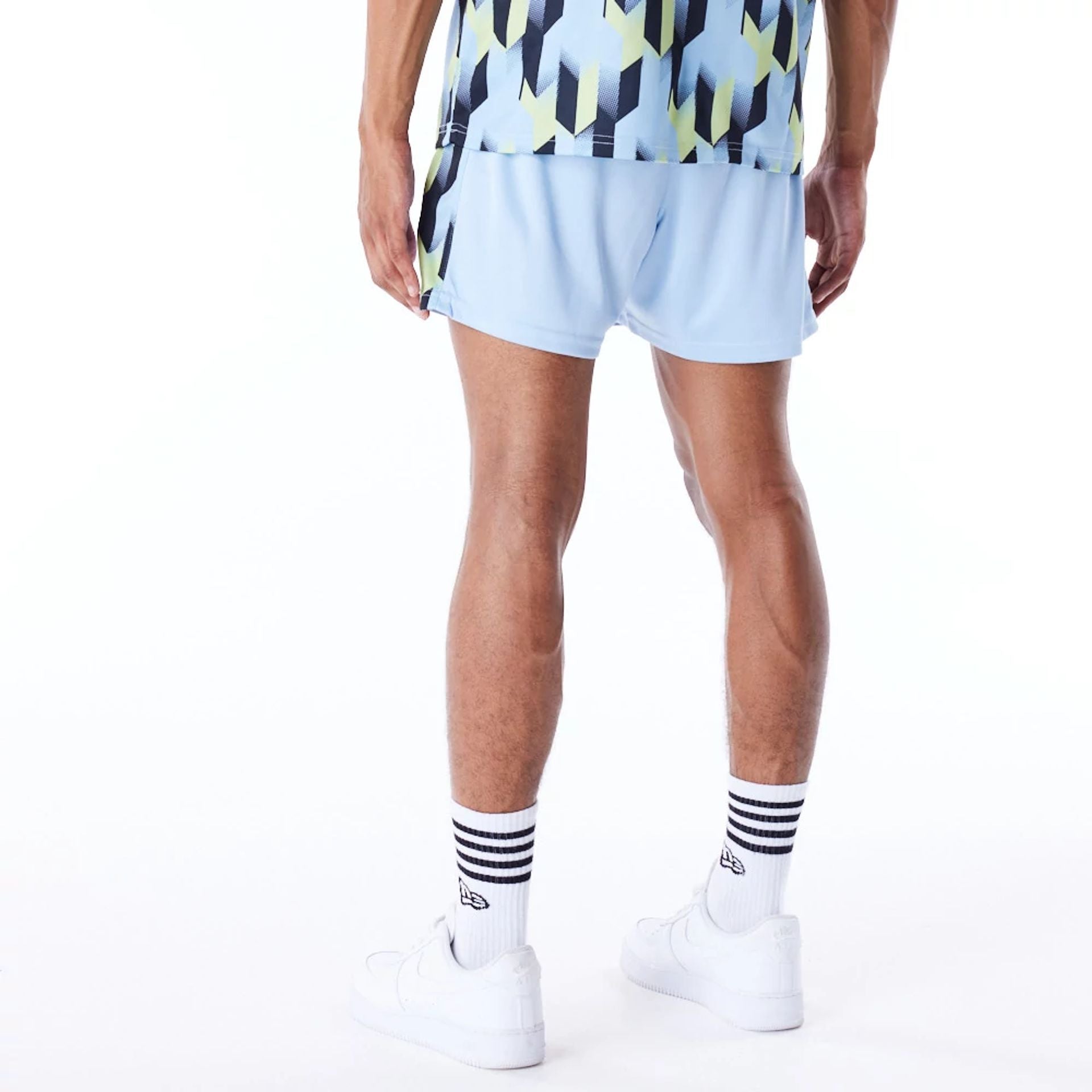 The Male model is wearing Milwaukee Bucks NBA Soccer Pastel Blue Short Shorts 4