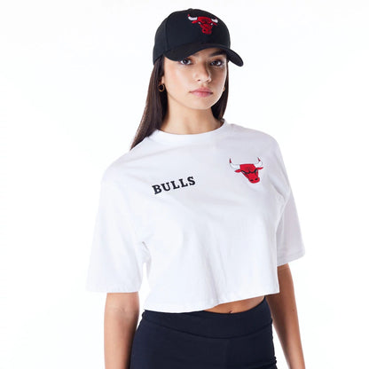 The Female model is wearing Chicago Bulls Womens NBA Team Logo Wordmark White Crop T-Shirt 1